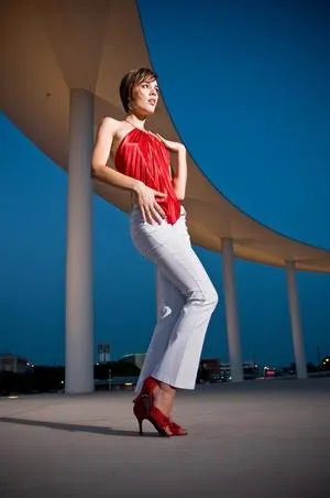 Shannon Lepard in a red top and heels